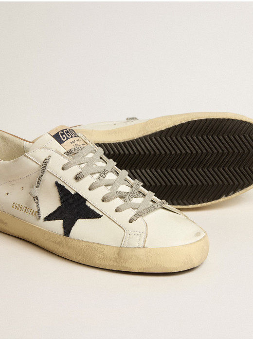 Men's Super-Star in white leather with midnight-blue canvas star and tobacco leather heel tab