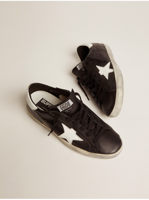 Women’s Super-Star in black leather with white leather star and heel tab