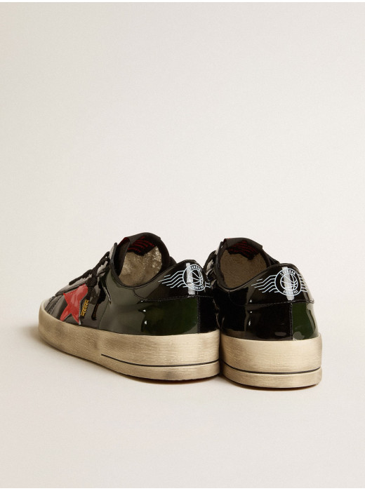 Stardan LAB in black and green patent leather with orange star